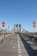 Brooklyn Bridge: pedestrian catwalk facing Manhattan, traffic-signs