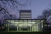 glass-cladded textile-concrete pavillon: Northern view at dusk
