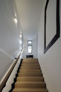 Tebartz-van Elst: frame house: staircase from lobby up to first floor
