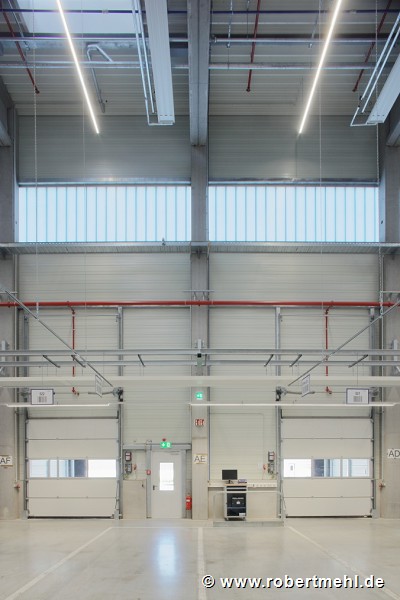 ebm-papst: inside logistic-center, loading-ramp sectional-gate, portrait