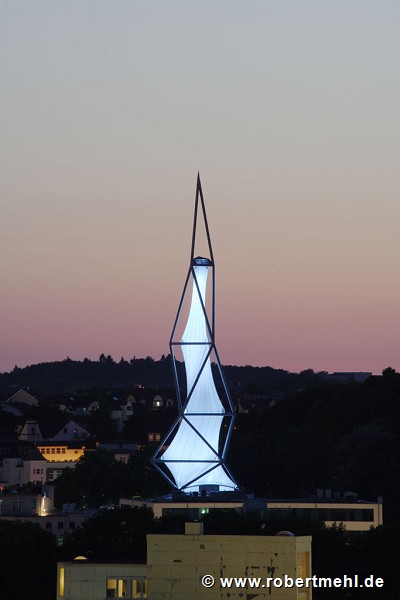 Phänomenta: illuminated tower at dusk seen from Anna-hill
